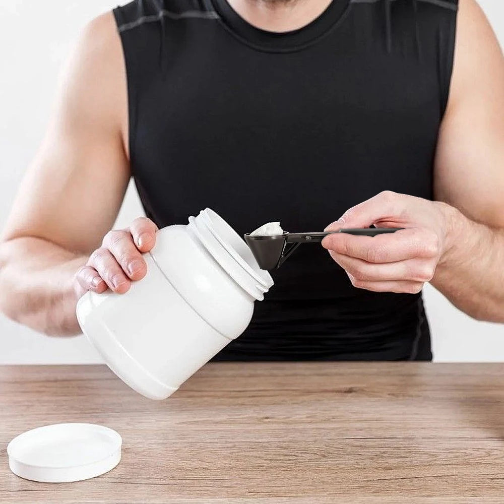 Measuring spoon with funnel for protein and coffee.